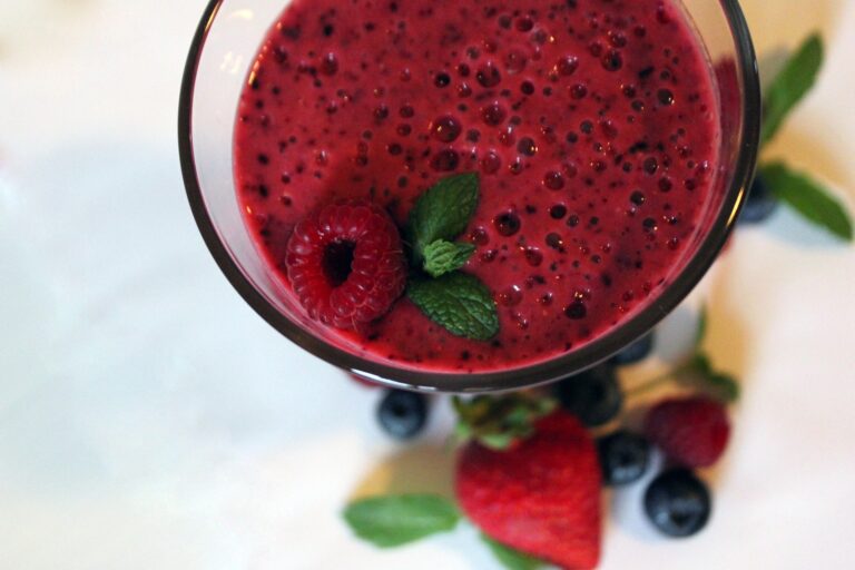 Raspberry smoothie in a transparent glass